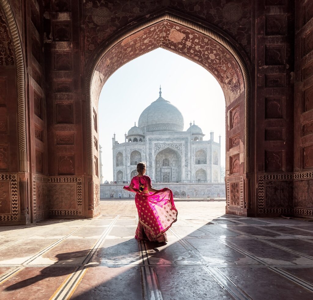 Woman in sari at Taj Mahal | India | Swift Travel